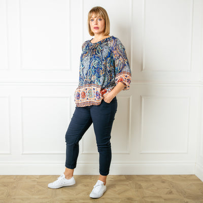 The navy blue Silk Blend Paisley Top with a round neckline with elastic and gathering around the neckline